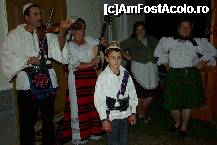 [P01] Ioana (in the background) with daugther (right), grandson and musicians they had invited to entertain their guests on the evening of Aug. 13, 2011 in front of the guest house » foto by Matthias
 - 
<span class="allrVoted glyphicon glyphicon-heart hidden" id="av297443"></span>
<a class="m-l-10 hidden" id="sv297443" onclick="voting_Foto_DelVot(,297443,9142)" role="button">șterge vot <span class="glyphicon glyphicon-remove"></span></a>
<a id="v9297443" class=" c-red"  onclick="voting_Foto_SetVot(297443)" role="button"><span class="glyphicon glyphicon-heart-empty"></span> <b>LIKE</b> = Votează poza</a> <img class="hidden"  id="f297443W9" src="/imagini/loader.gif" border="0" /><span class="AjErrMes hidden" id="e297443ErM"></span>