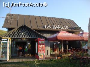 [P06] Campingul 'Muddyland' - Există în incinta campingului o zonă numită 'La Hangar' unde se află un magazin şi o terasă.  » foto by Floryn81
 - 
<span class="allrVoted glyphicon glyphicon-heart hidden" id="av893331"></span>
<a class="m-l-10 hidden" id="sv893331" onclick="voting_Foto_DelVot(,893331,22571)" role="button">șterge vot <span class="glyphicon glyphicon-remove"></span></a>
<a id="v9893331" class=" c-red"  onclick="voting_Foto_SetVot(893331)" role="button"><span class="glyphicon glyphicon-heart-empty"></span> <b>LIKE</b> = Votează poza</a> <img class="hidden"  id="f893331W9" src="/imagini/loader.gif" border="0" /><span class="AjErrMes hidden" id="e893331ErM"></span>